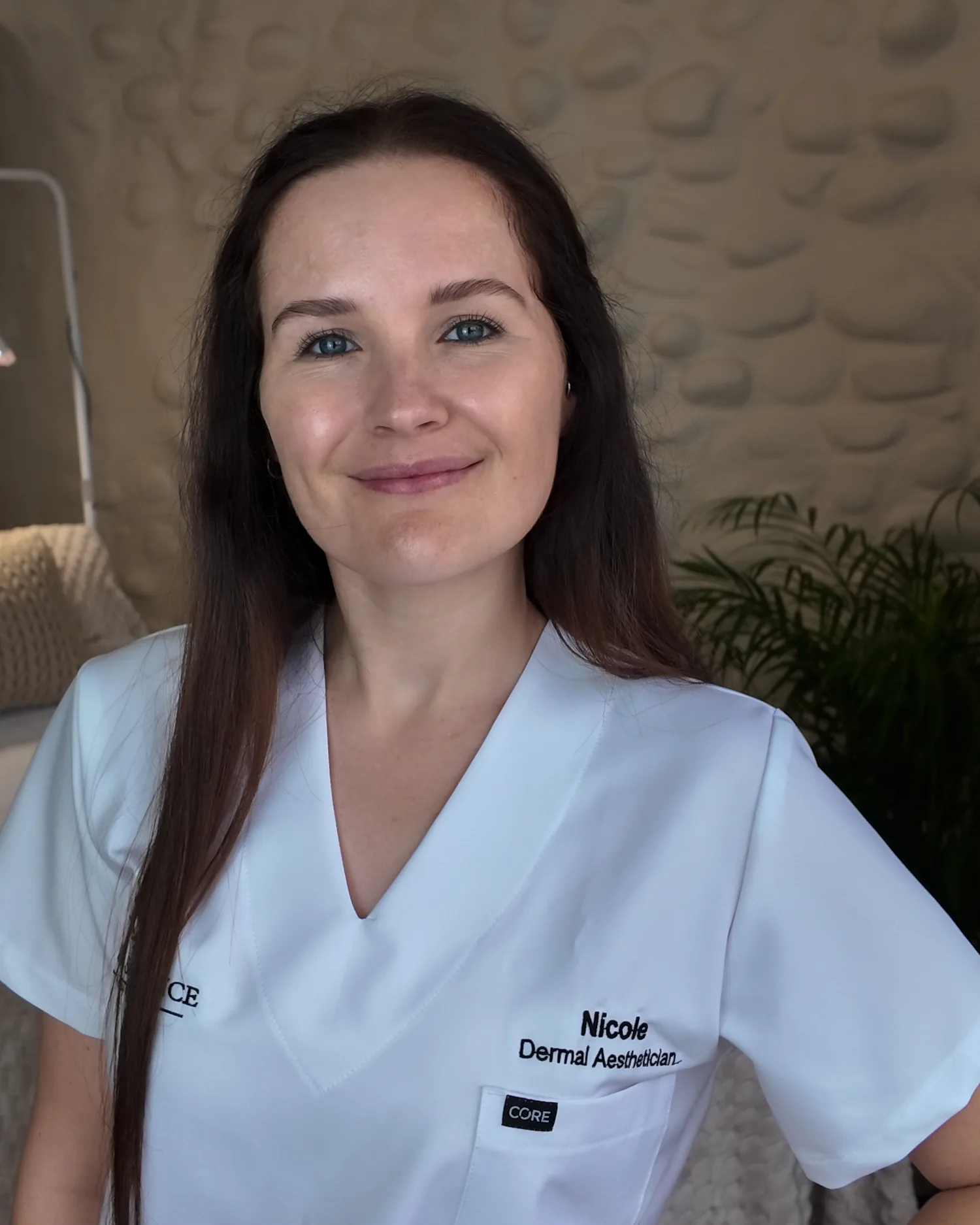 Nicole Oleastro in the Skin Science Aesthetics treatment room, in clinic whites
